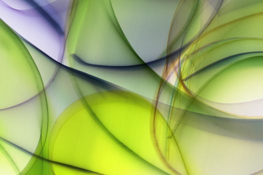 Dynamic abstract art with flowing green and purple shapes creating a vibrant swirl effect.