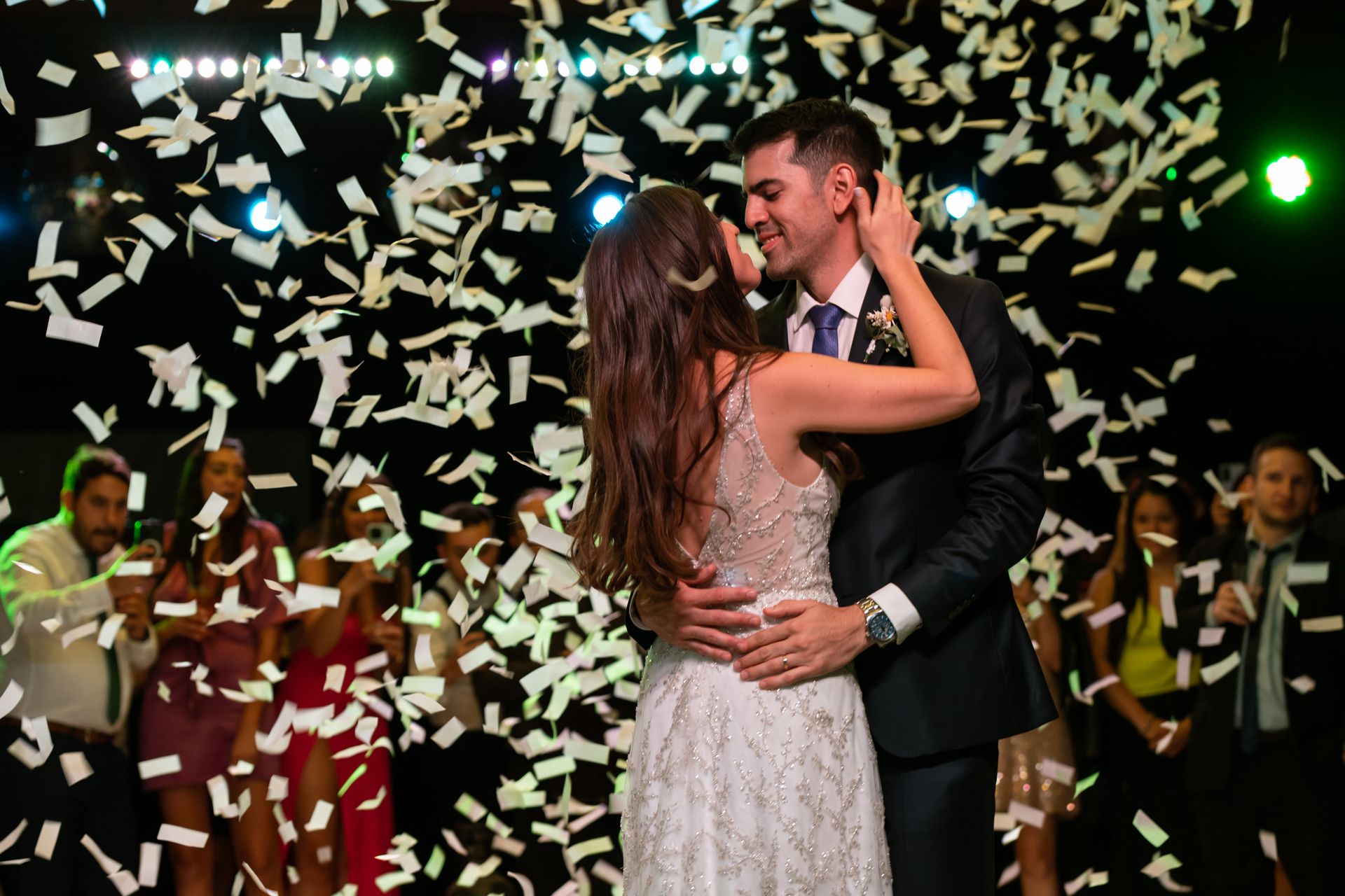 Couple dancing with confetti at a luxury celebration