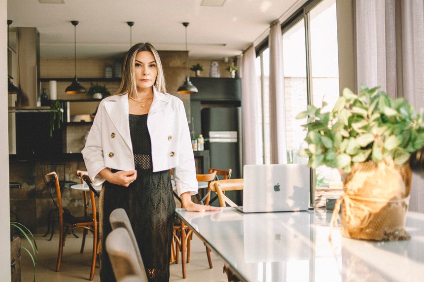 Person in a light blazer standing in a bright interior, photo by Alax Matias on Pexels