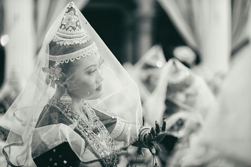 Free A graceful depiction of a traditional Manipuri dancer in ceremonial attire during a cultural performance. Stock Photo