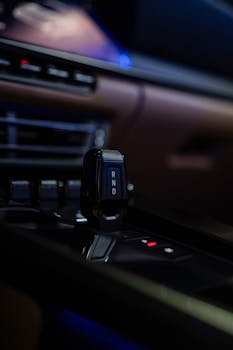 A detailed view of a car's gear shift showcasing modern automotive interior design.