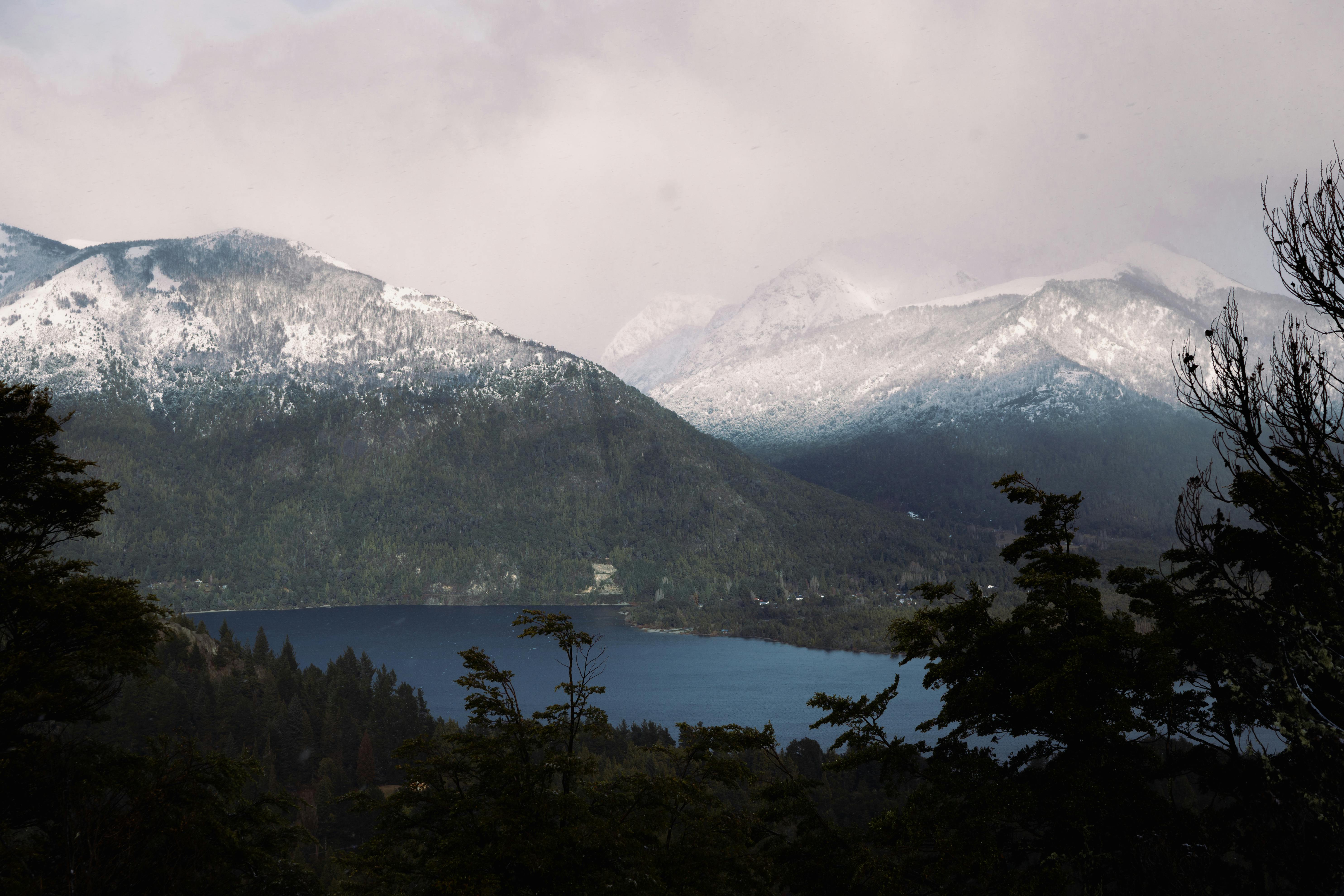 Captivating winter landscape of snow-covered mountains in Bariloche, Argentina.