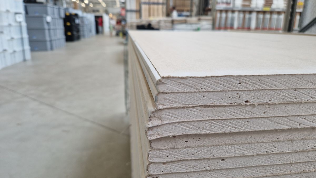 Stacks of drywall panels at a supplier. Sheets come 4 ft wide in 8, 9, 10 and 12 ft lengths.