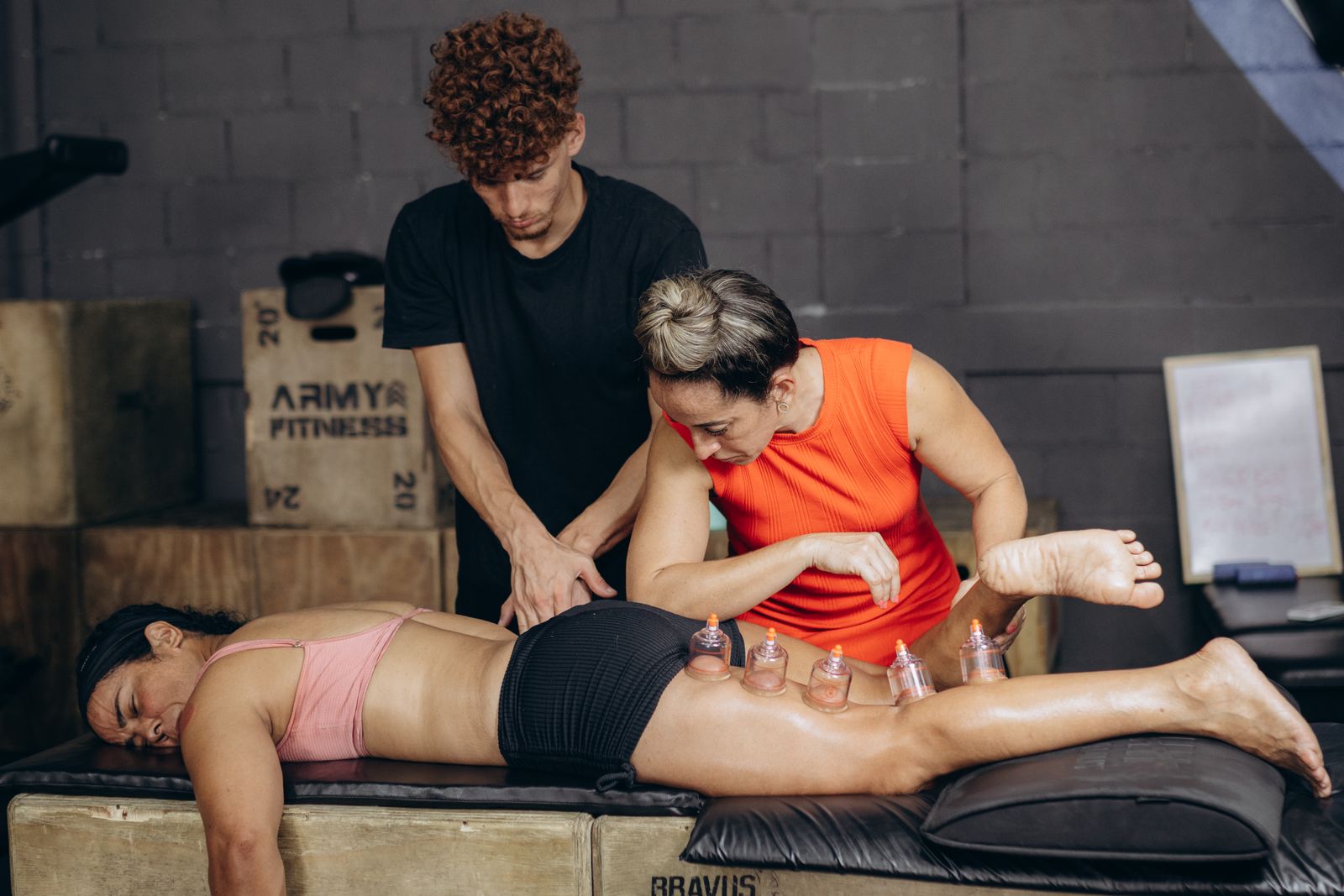 Active adult stretching outdoors with hands near the lower back