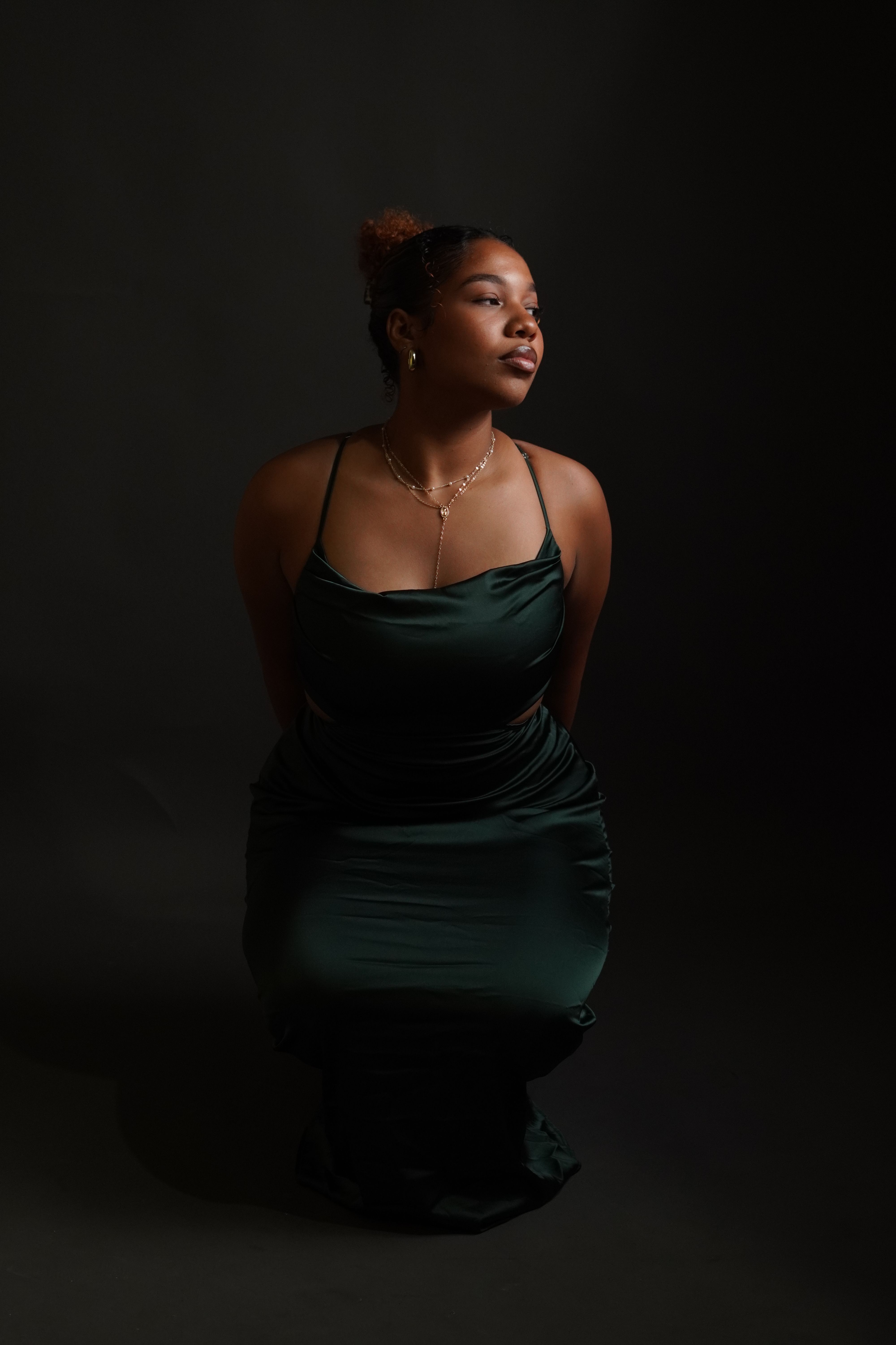 A woman in a green dress sitting down Free Stock Photo A woman in a green dress sitting down Free Stock Photo