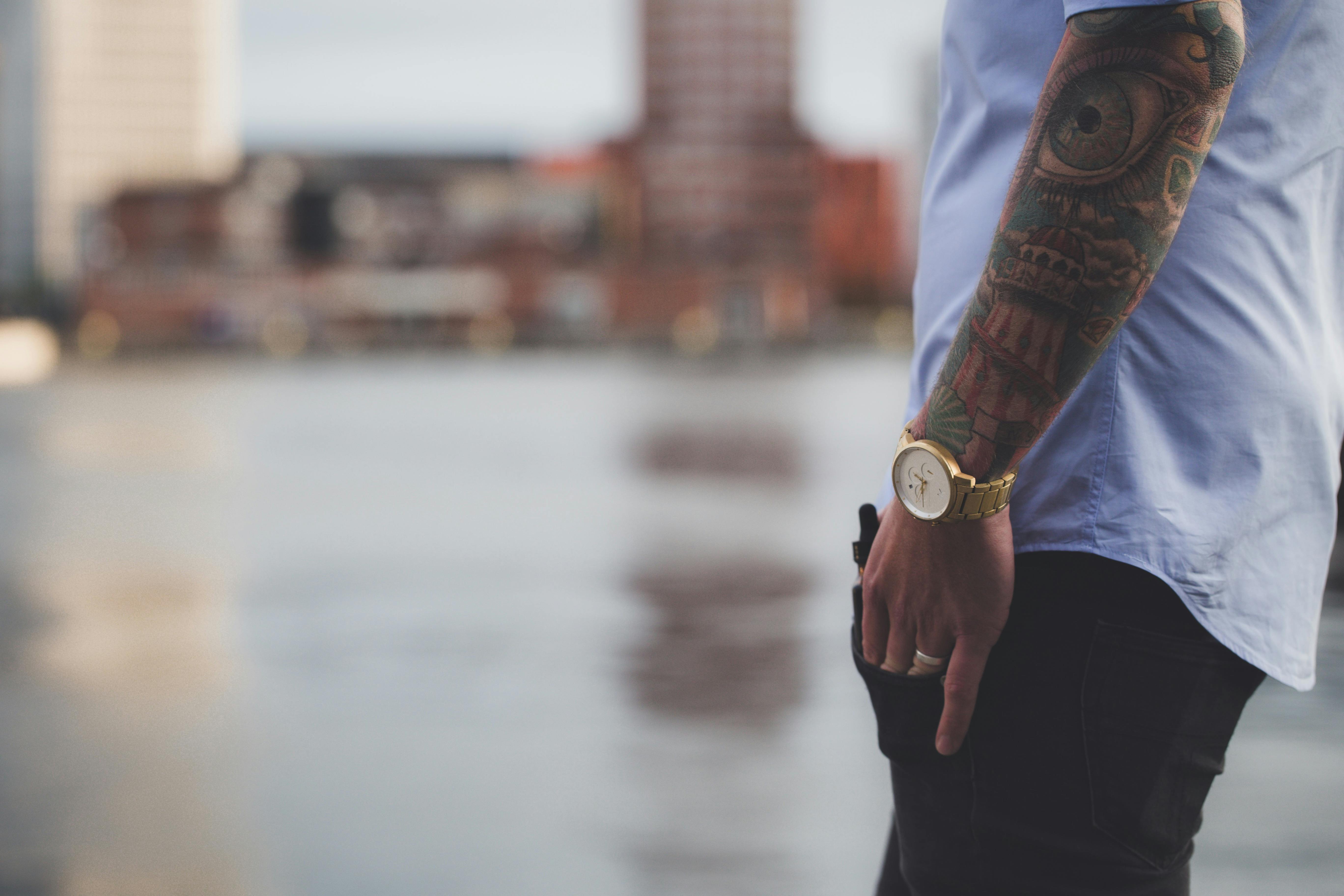 Selective Focus Photography of Man Wearing Blue Shirt