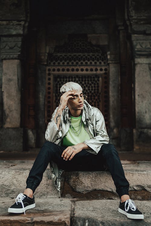 Man Wearing Gray Jacket and Black Jogger Pants