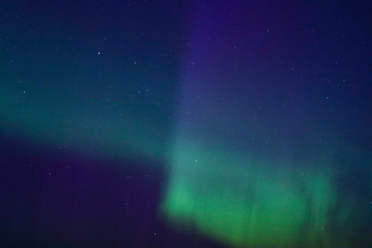 Captivating view of the Northern Lights illuminating the tranquil night sky over Sweden.