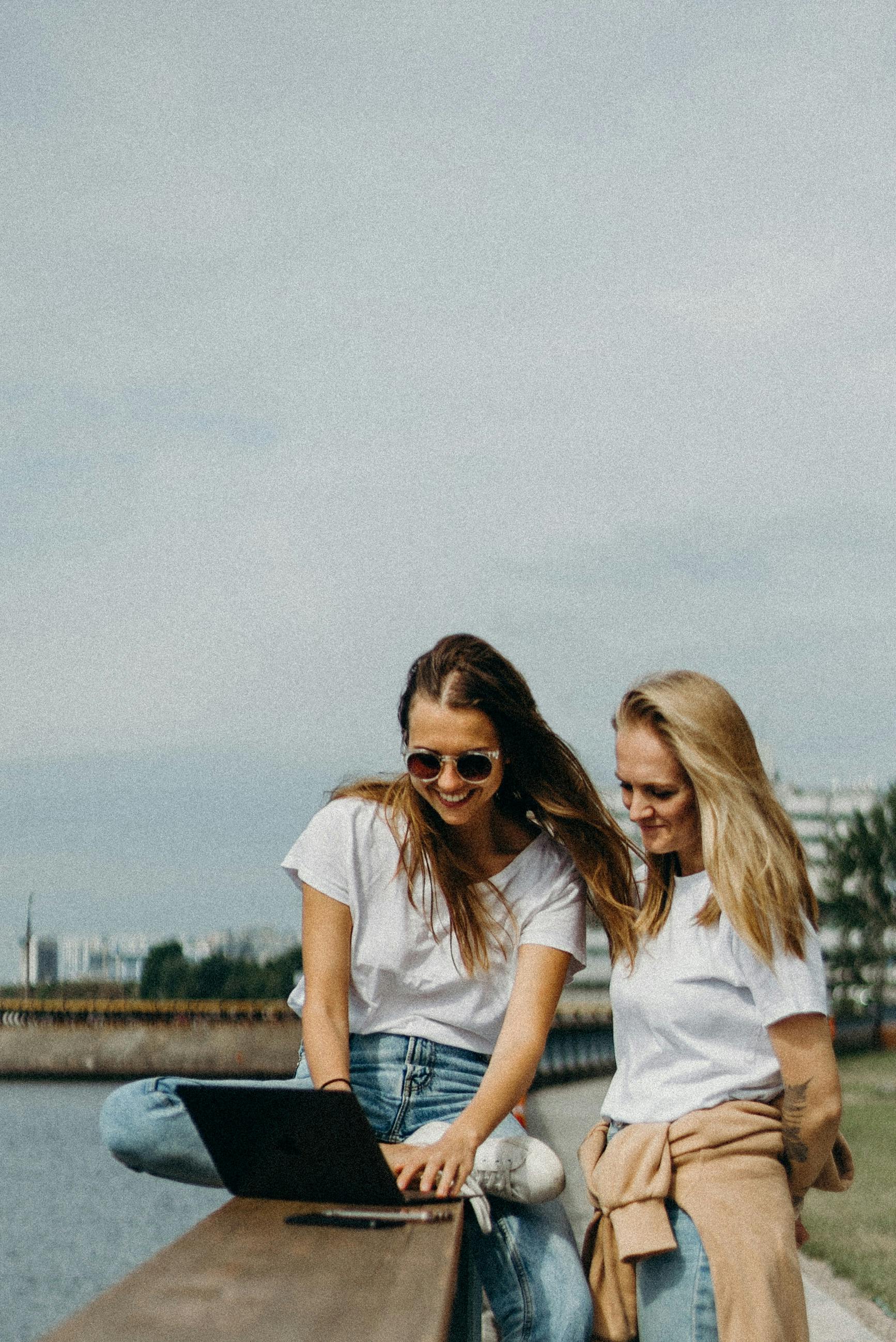 two women in white shirts