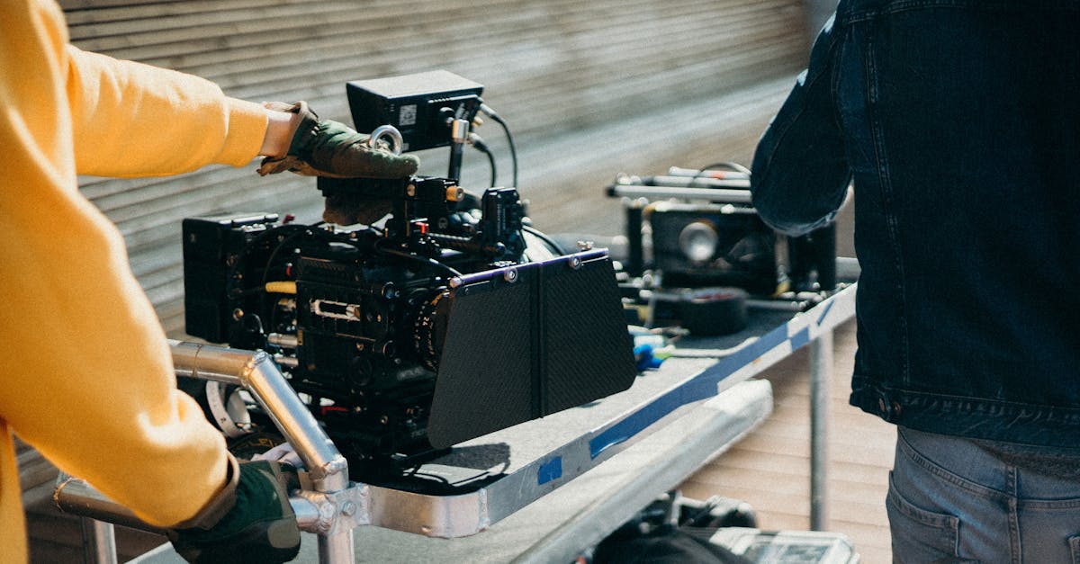 Photo by cottonbro studio Close-up view of professional film equipment on a movie set with crew members preparing for filming.