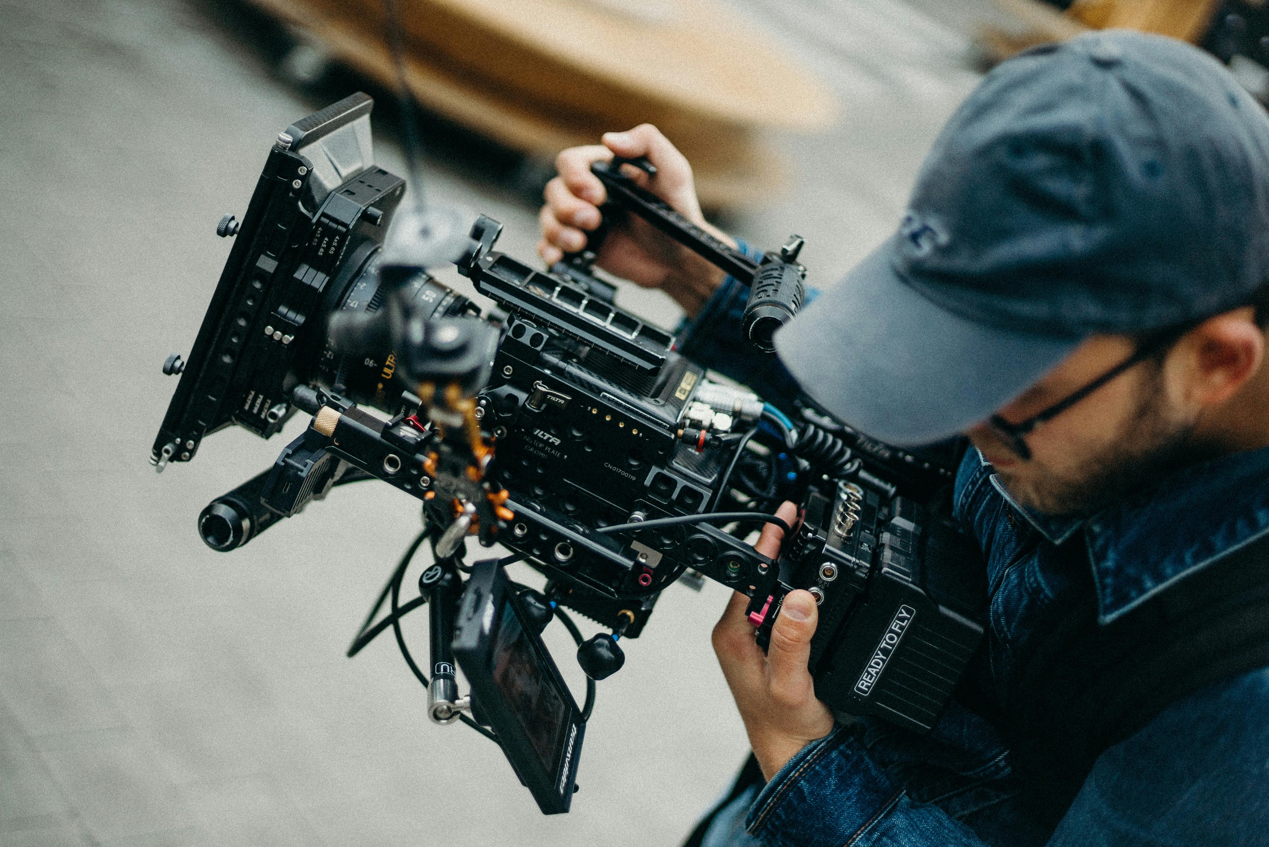 photo of man holding camera