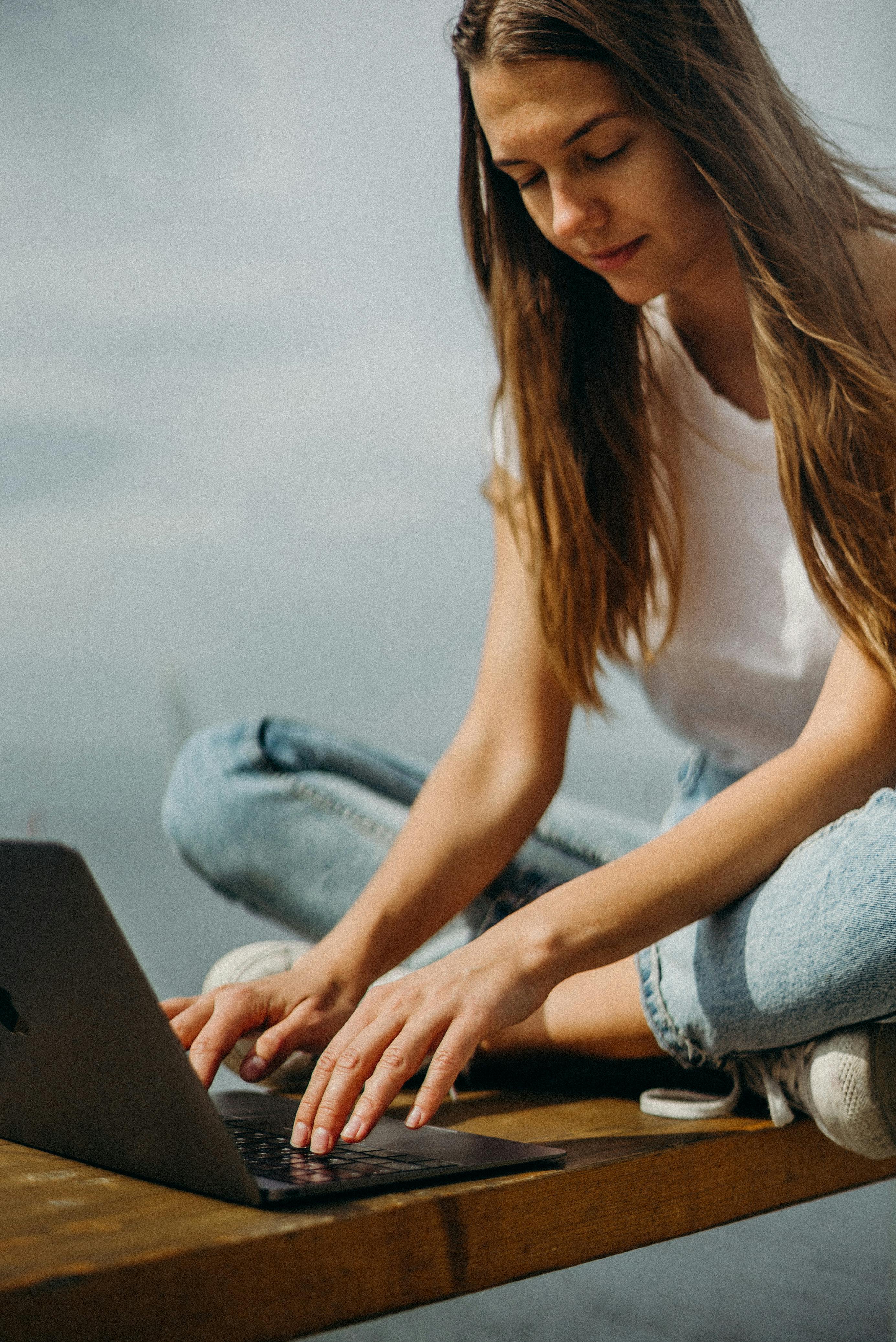 woman using macbook