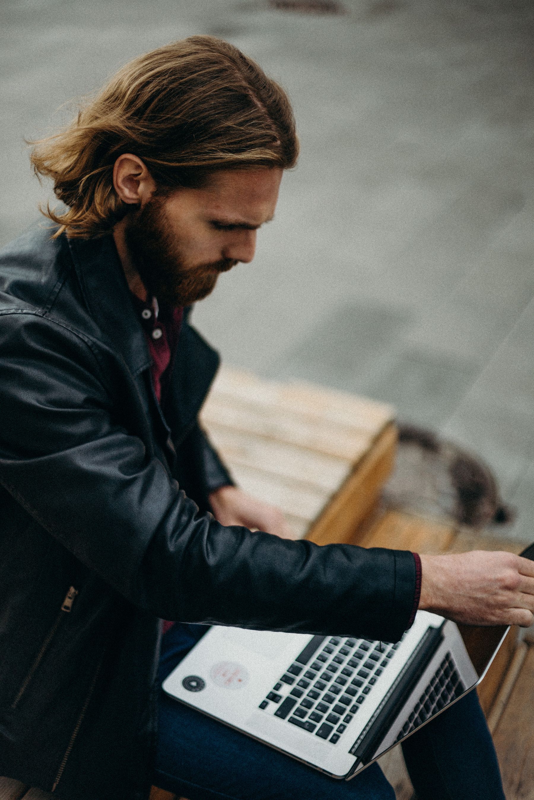 Person using a laptop outdoors