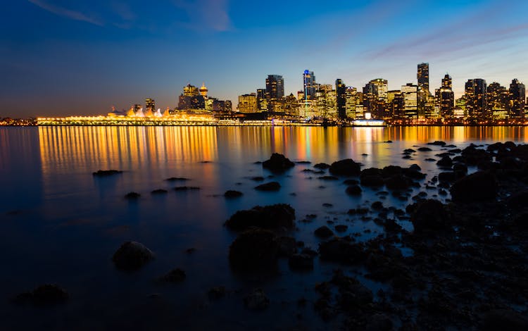 Cityscape Near Body Of Water