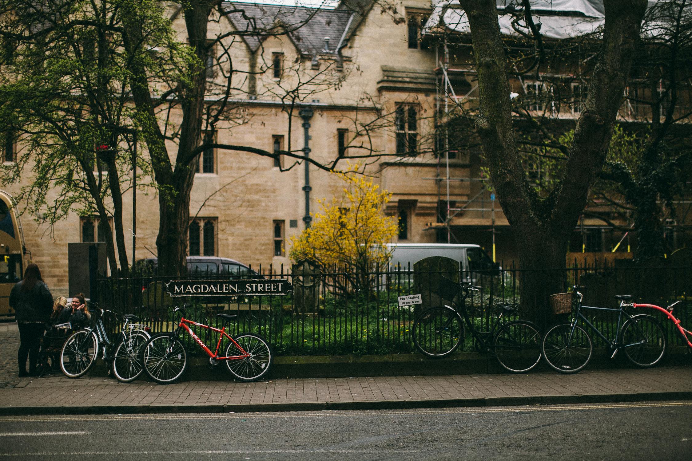 Bicycles Parked Near a Fence