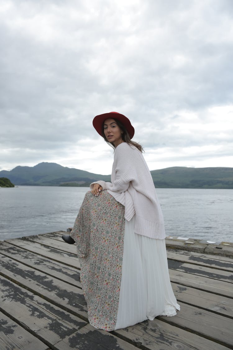 Woman Standing On Wooden Dock