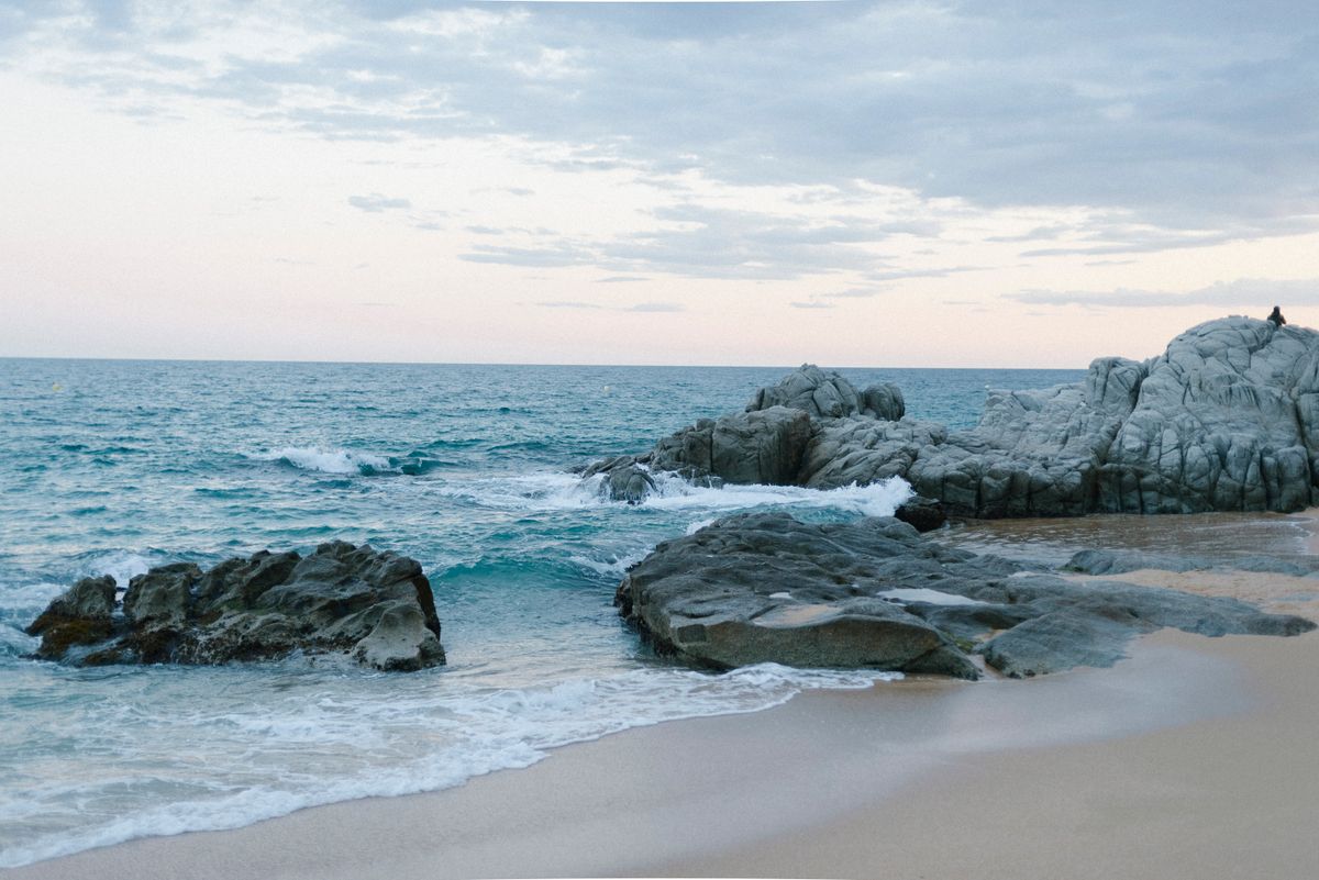 Rocks on Beach and in Sea · Free Stock Photo