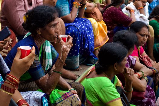 Group of Indian women engaging in a cultural ceremony in Varanasi, India.