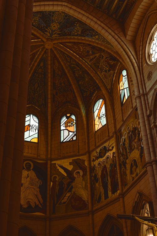 Free Marvel at the beautiful stained glass and mosaic artworks inside a historic cathedral's dome. Stock Photo