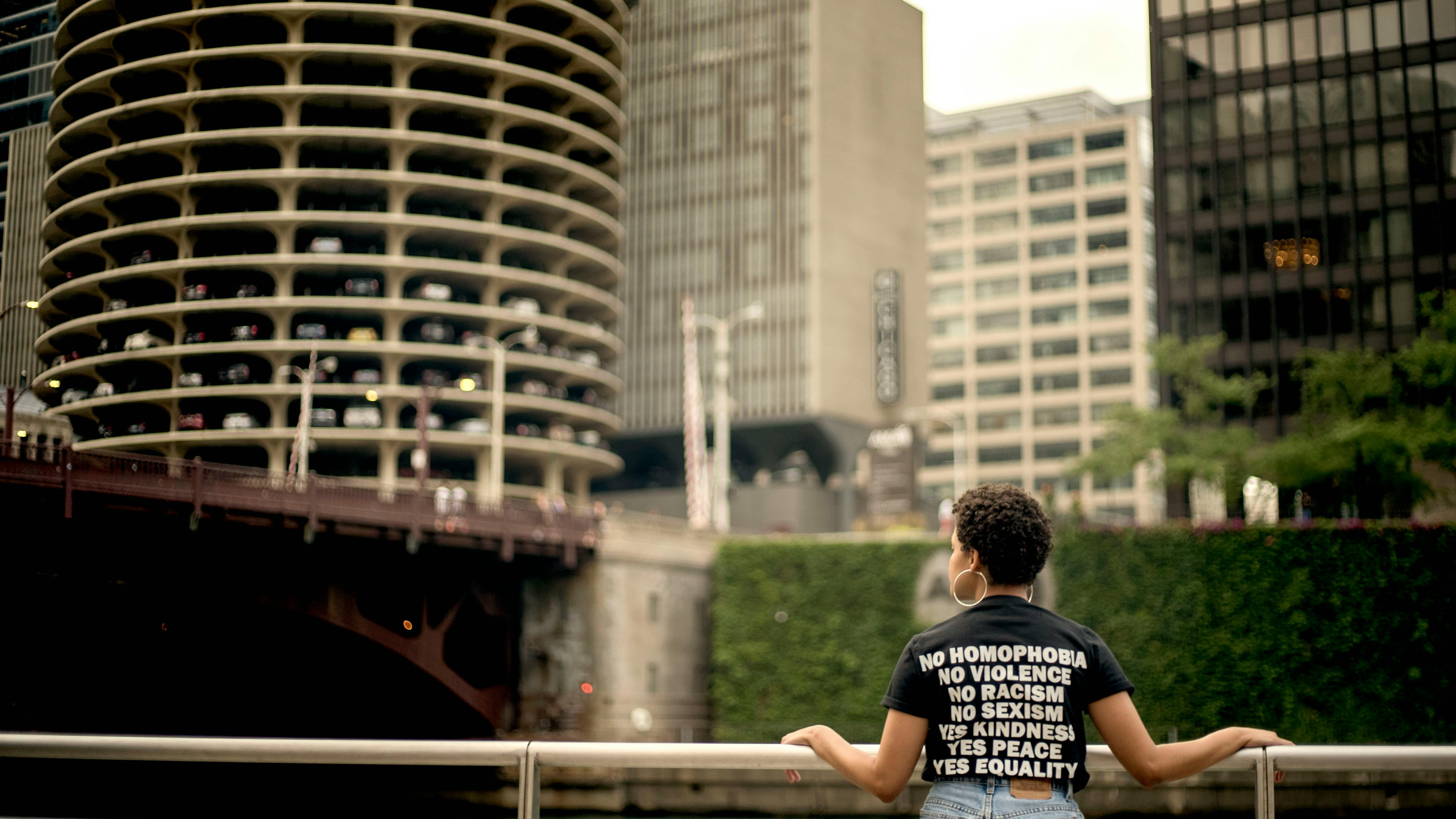 person walking a dog along the Chicago Riverwalk in River North - Pet-friendly apartments Chicago