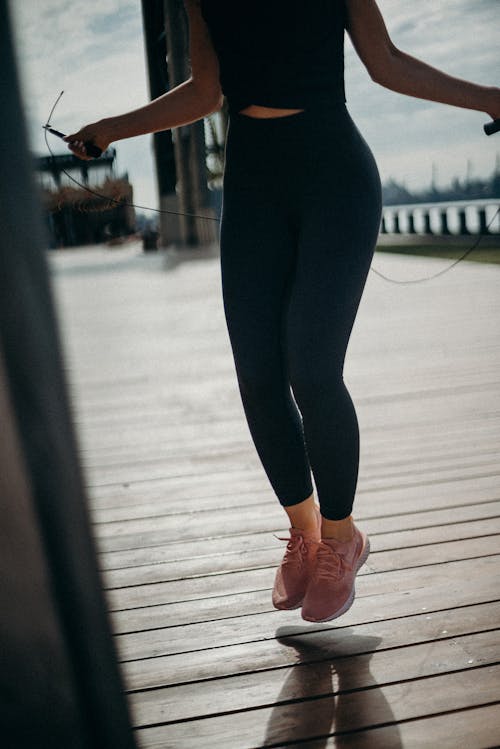 Woman on Dockside Doing Exercise