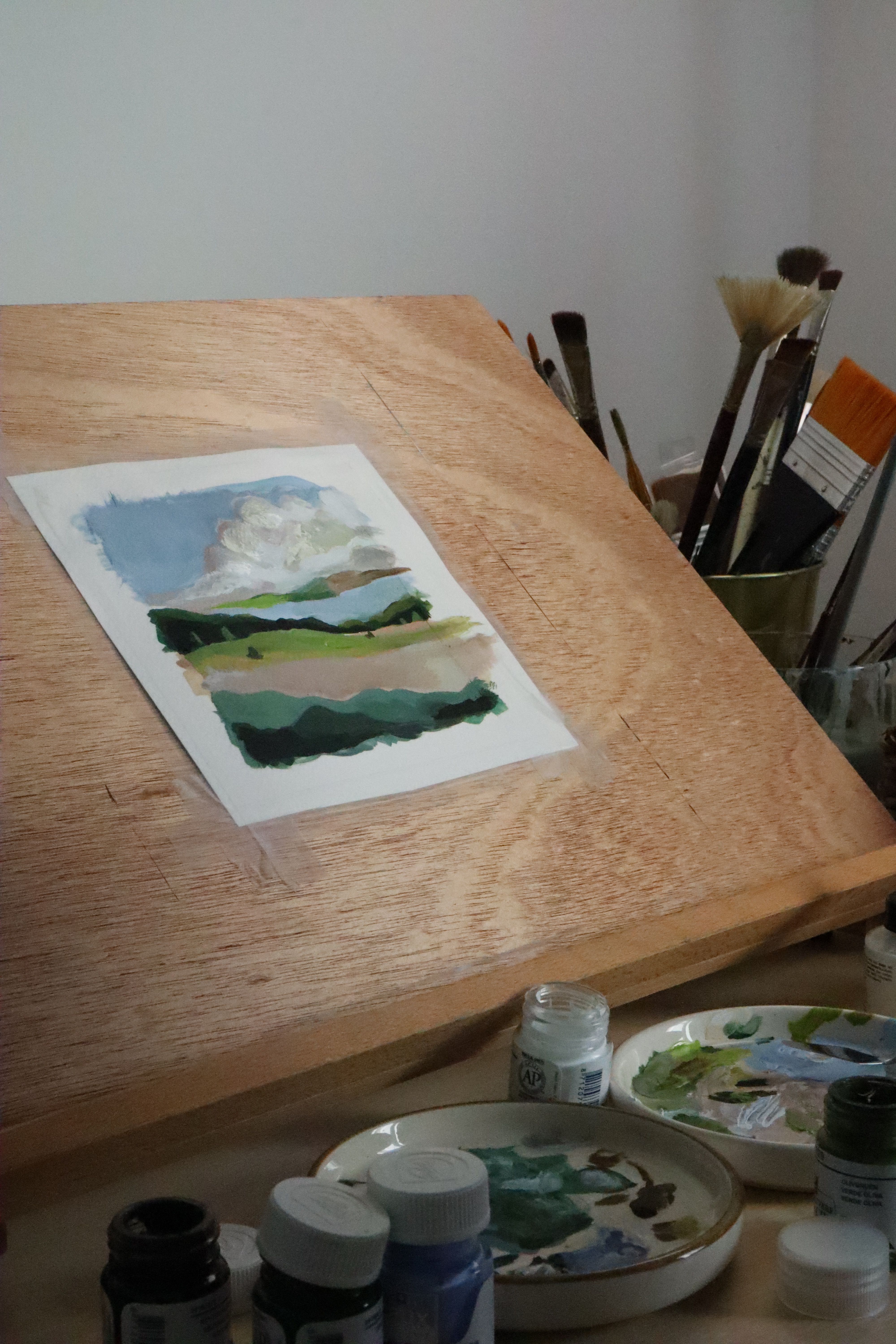 Painting on wooden easel with palette