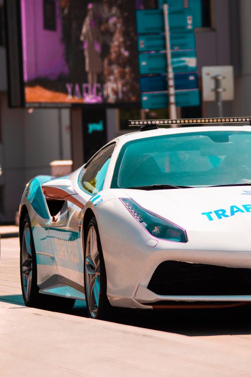 Free Sleek luxury police car on display in an urban setting, showcasing high performance and style. Stock Photo