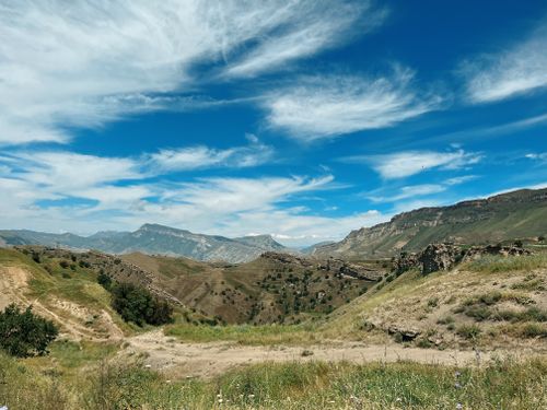 Free Stunning view of the mountains in Dagestan, Russia with clear skies and rugged landscape. Stock Photo