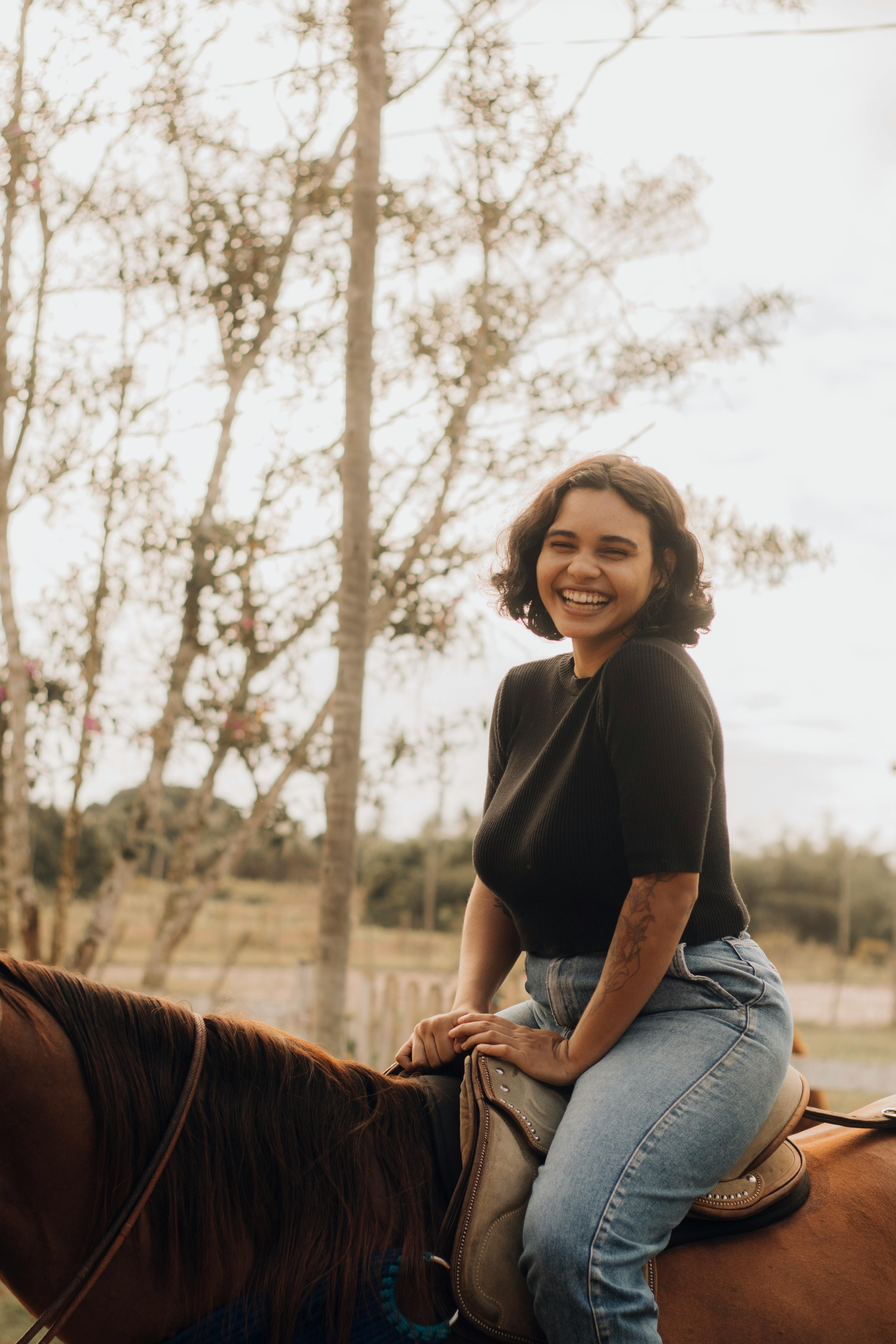 joyful horseback riding woman