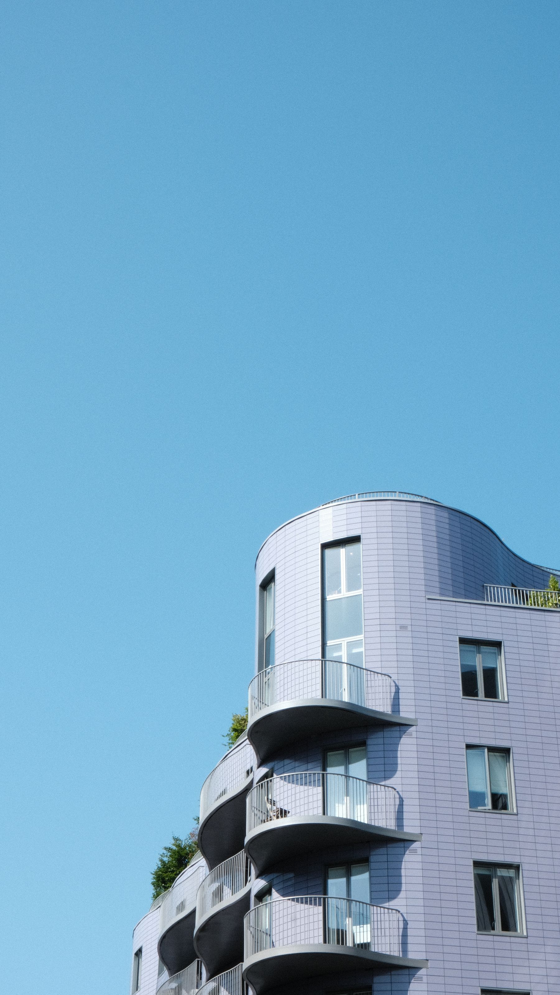 Architectural residence surrounded by mature green landscape