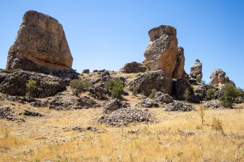 Free Stunning view of rocky formations under clear blue skies in Çermik, emphasizing erosion and geology. Stock Photo