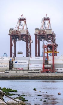 Industrial scene of container cranes at Callao Port in Lima, showcasing maritime logistics.