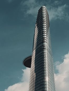 A modern skyscraper reaching toward the sky in Ho Chi Minh City, Vietnam.
