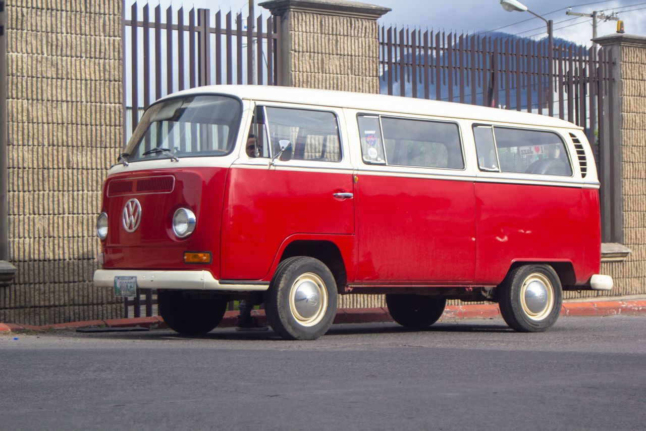 vintage volkswagen van parked on an urban street during the day