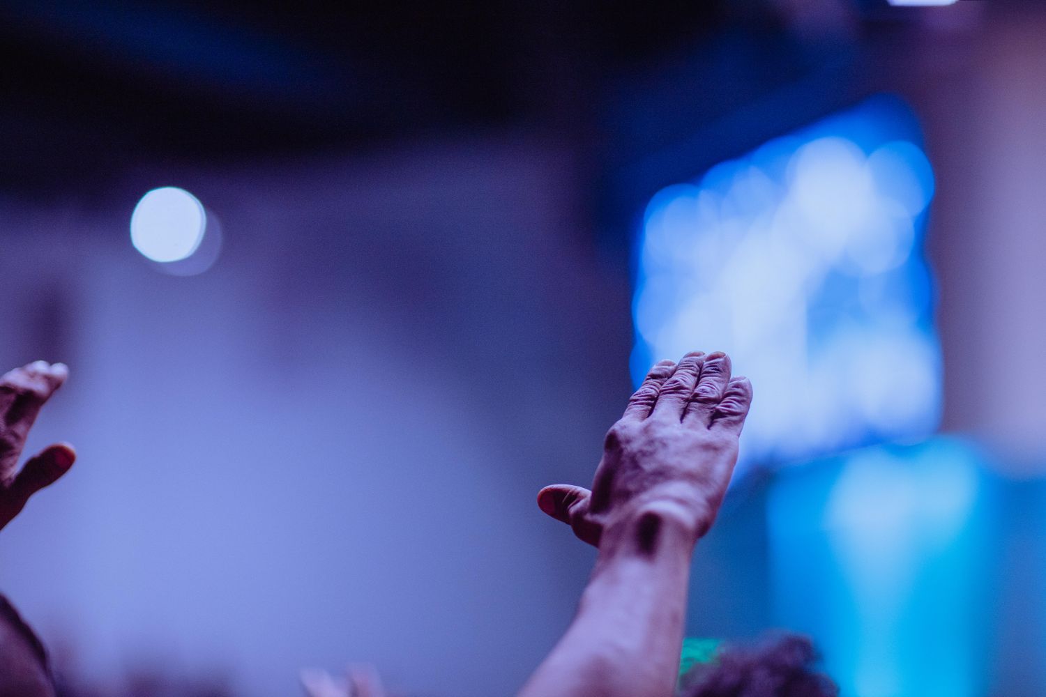 Hands raised during worship service