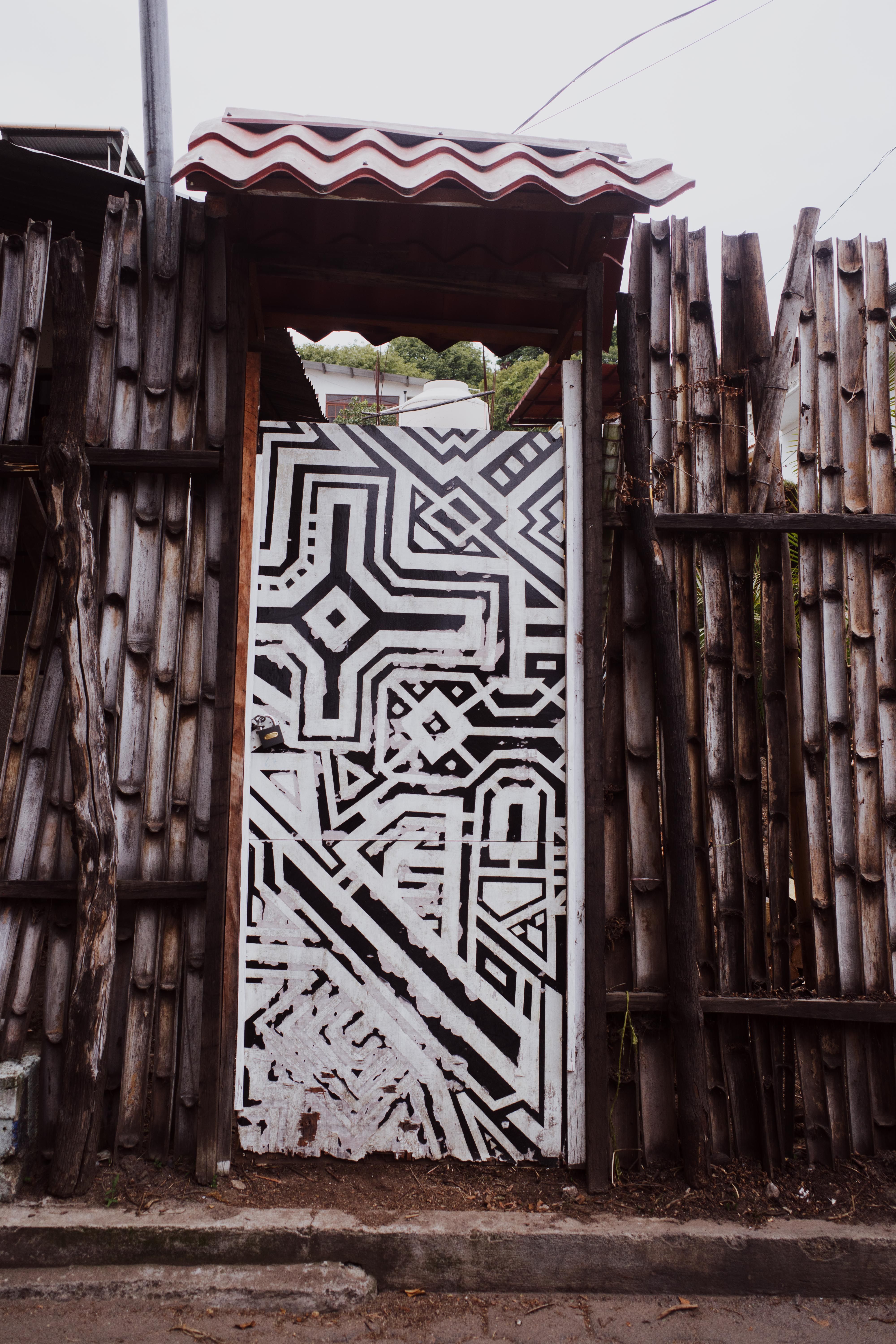A door with a pattern on it is painted white · Free Stock Photo