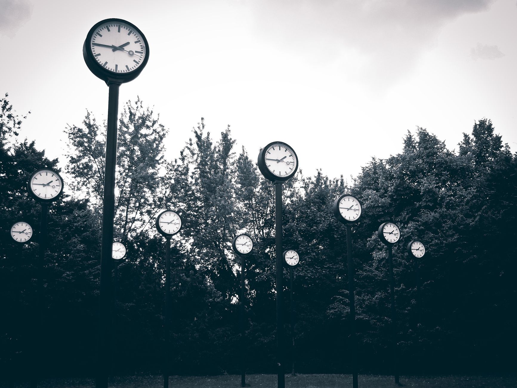 a wall clock showing multiple time zones while analysts prepare a World Cup match preview