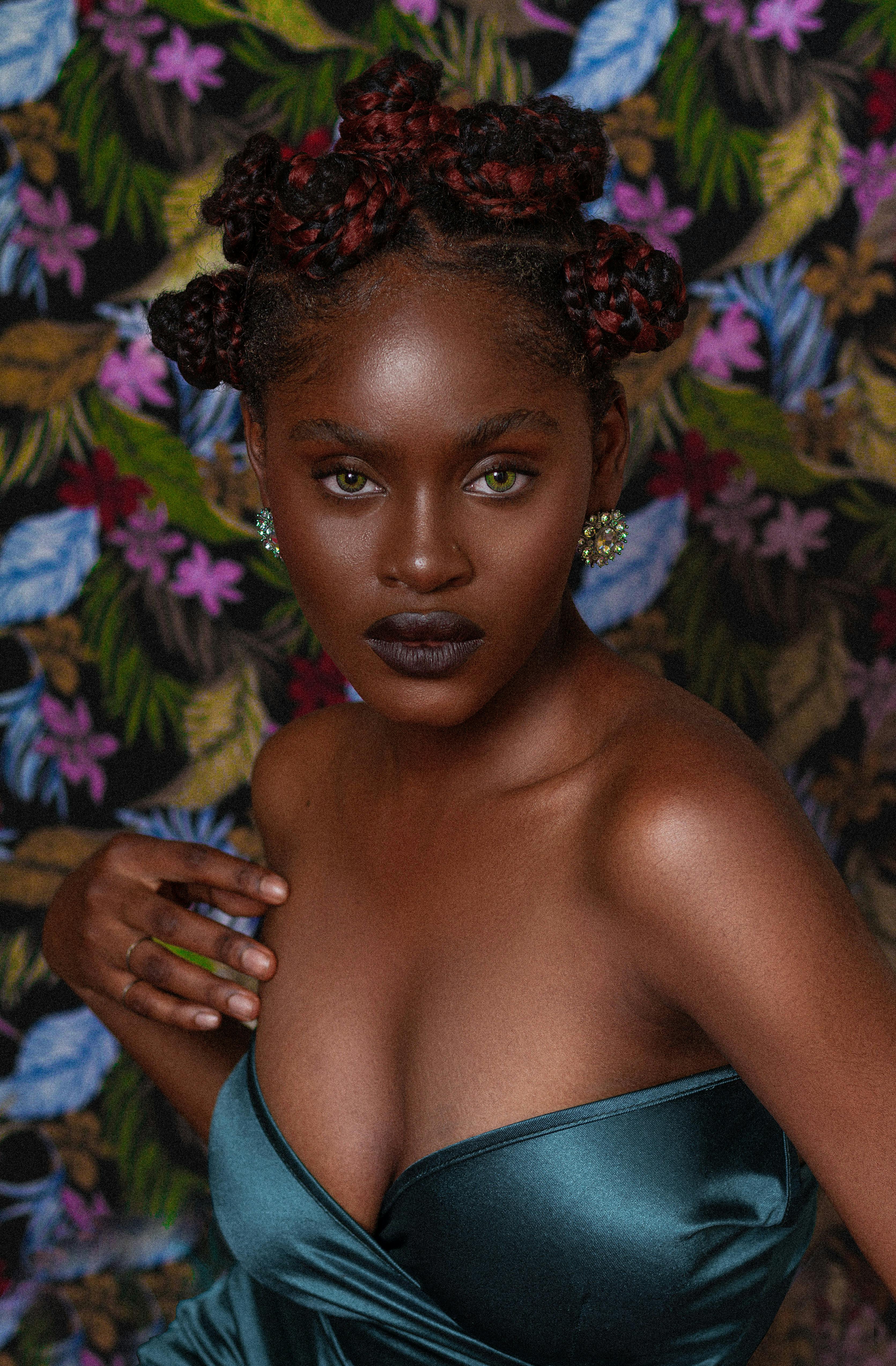 Stunning portrait of a stylish woman showcasing intricate hairstyle and elegant fashion.