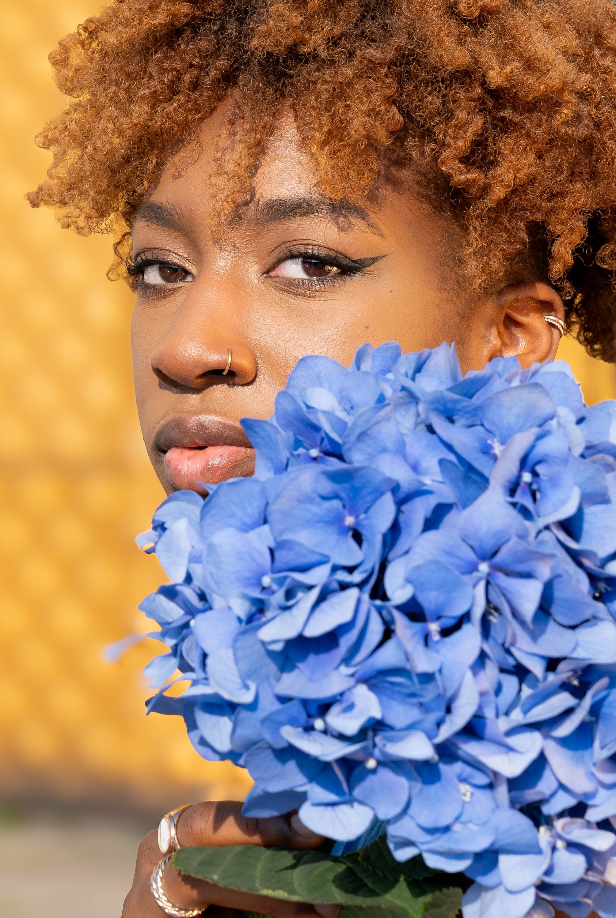 A woman with blue flowers in her hair · Free Stock Photo