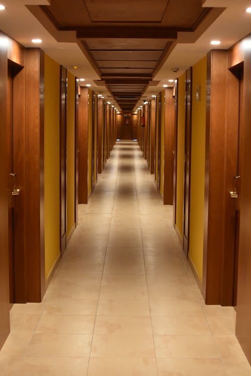 Free Turned-on Lights Along Hotel Hallway Stock Photo