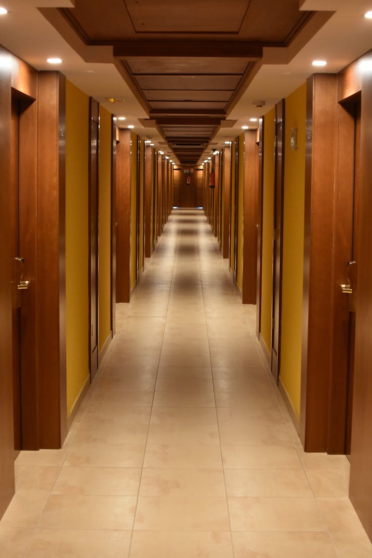 Turned-on Lights Along Hotel Hallway