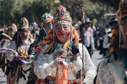 Colorful traditional dance at the Virgen del Carmen festival in Cusco, Peru.