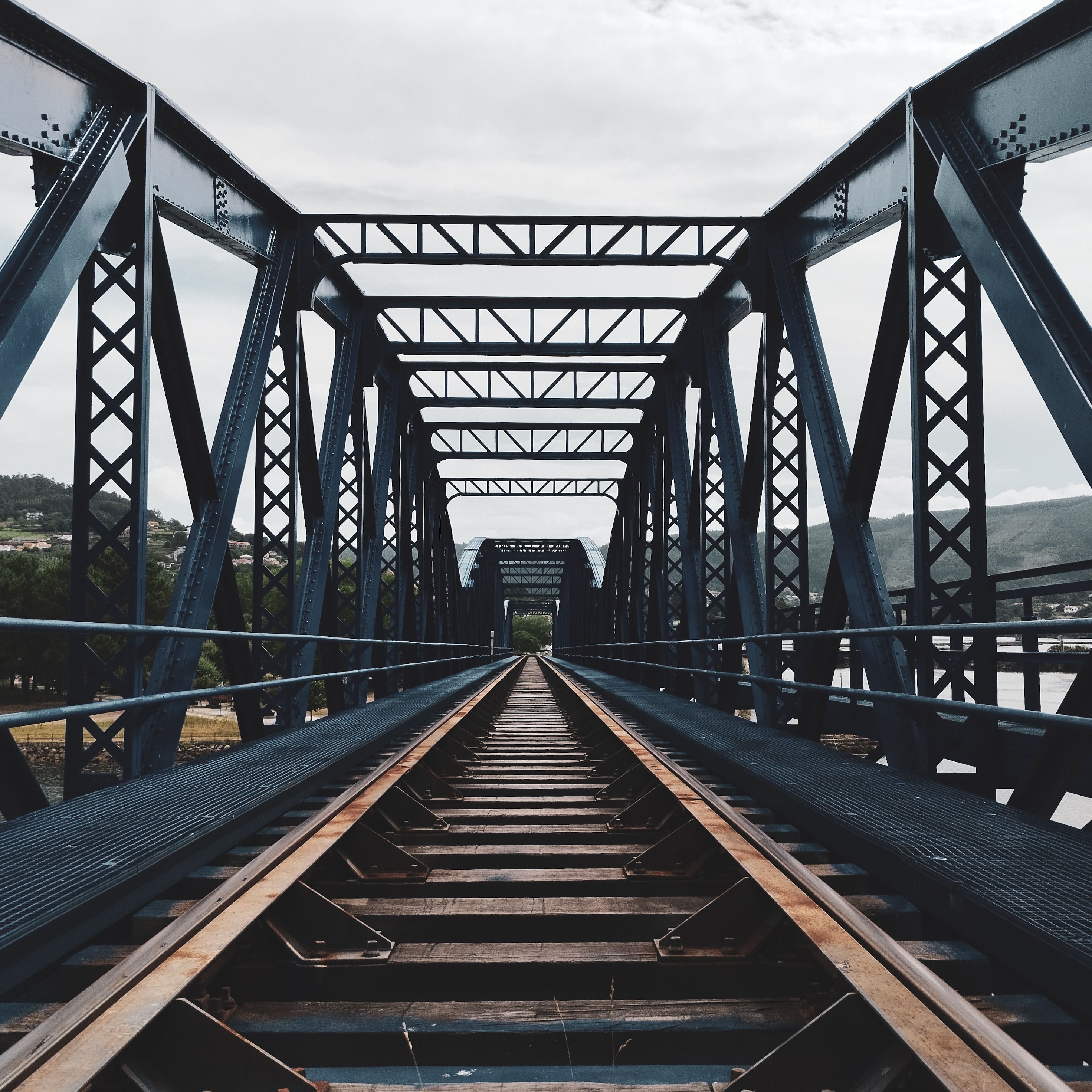 A train track with a bridge over it