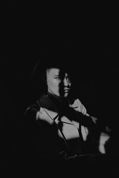 Artistic portrait with dramatic lighting and shadows creating a mysterious atmosphere.. artistic, portrait, with