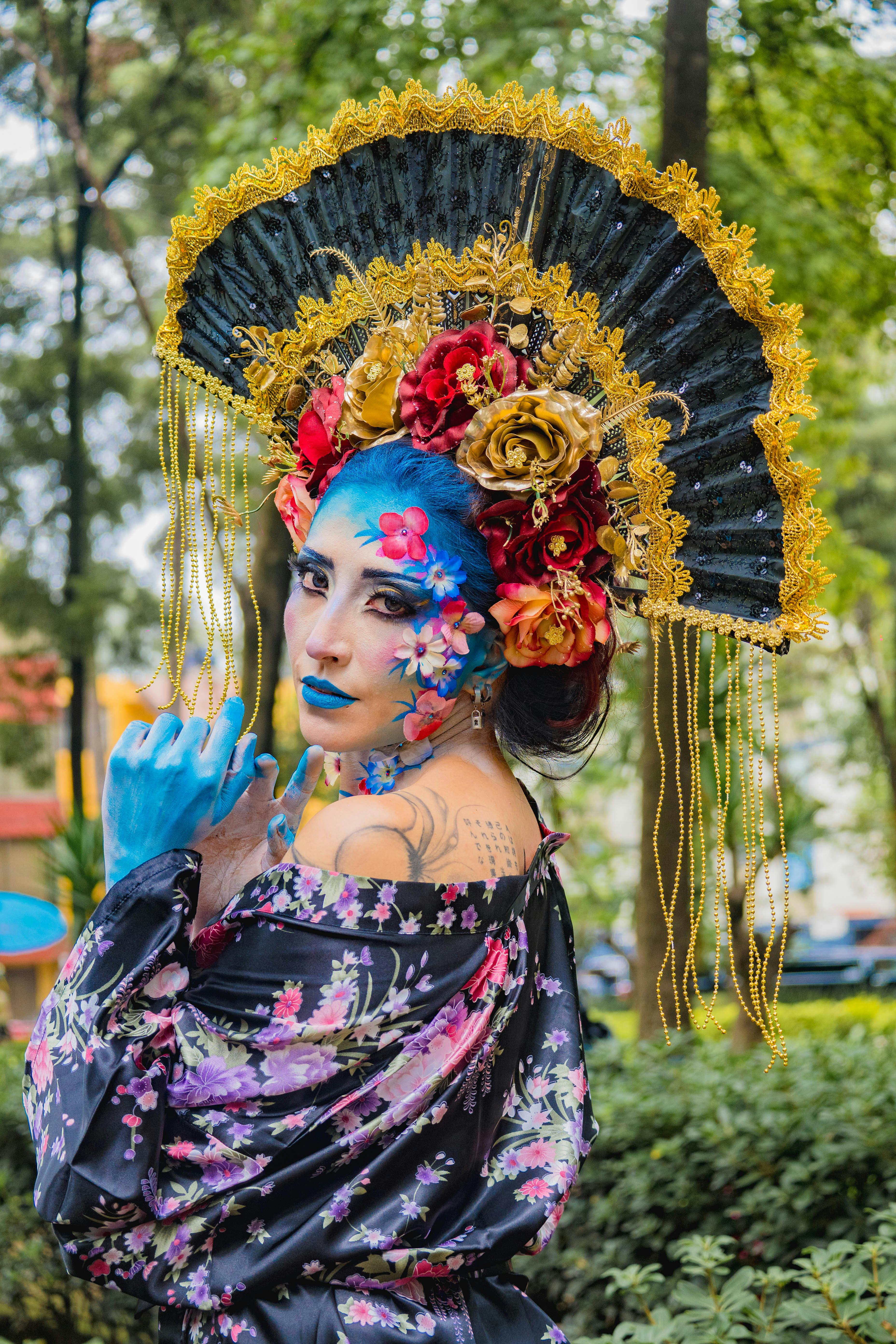 portrait of woman in costume with flowers wreath and hat