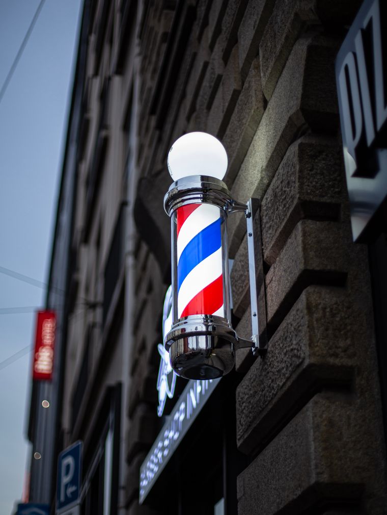 A barber pole on the wall
