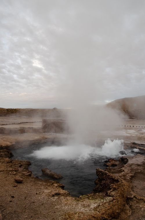 Free Geyser eruption with steam and mist in the Atacama Desert, Chile. Nature and geology marvel. Stock Photo
