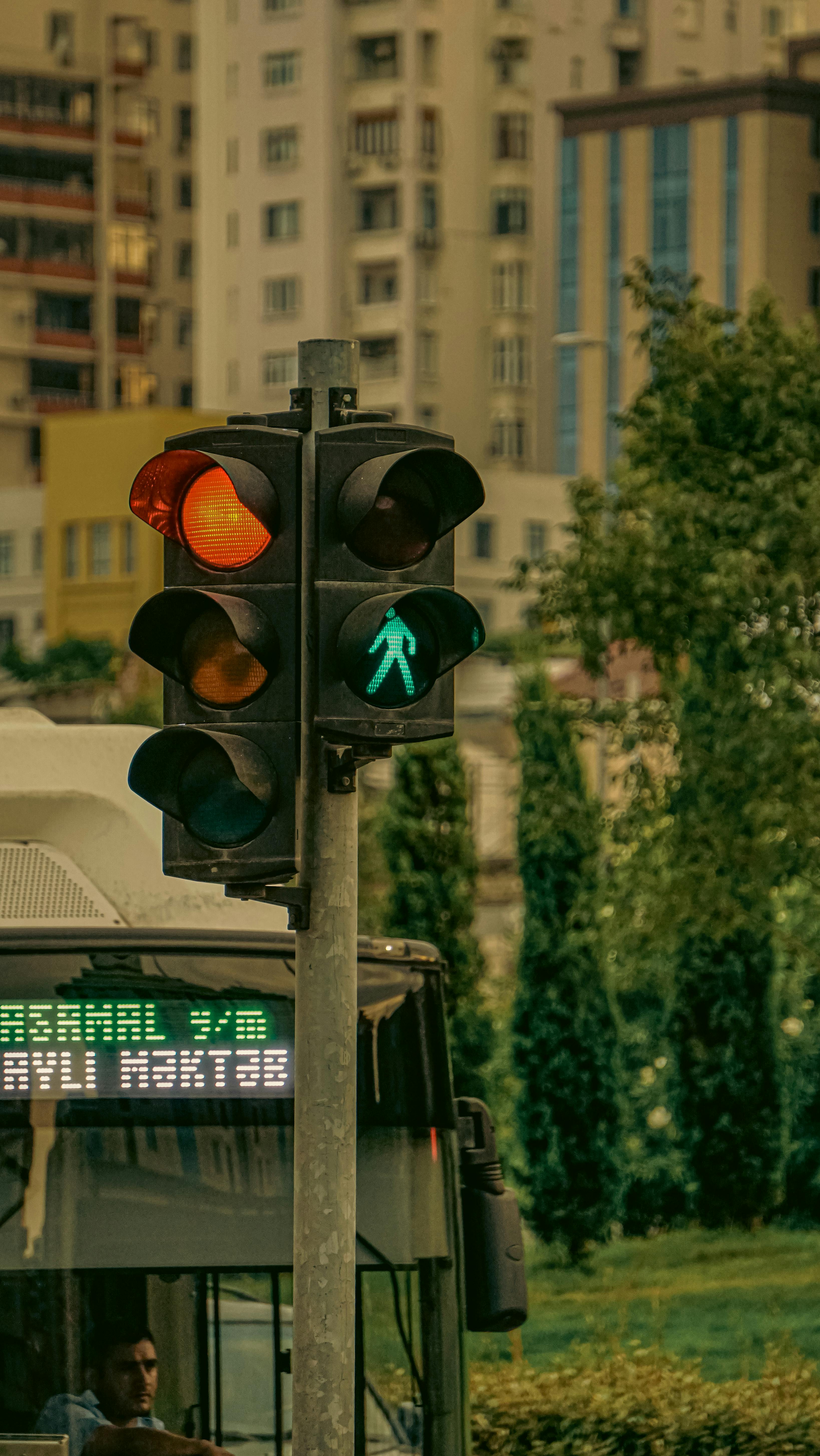 a traffic light is in front of a bus