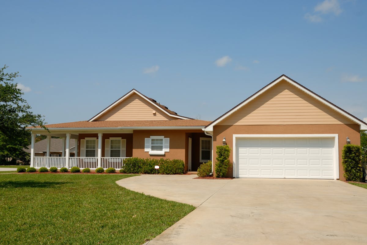 White Roll-up Door and house