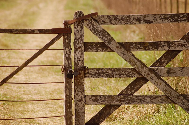 Straw and rustic farm gate in the countryside